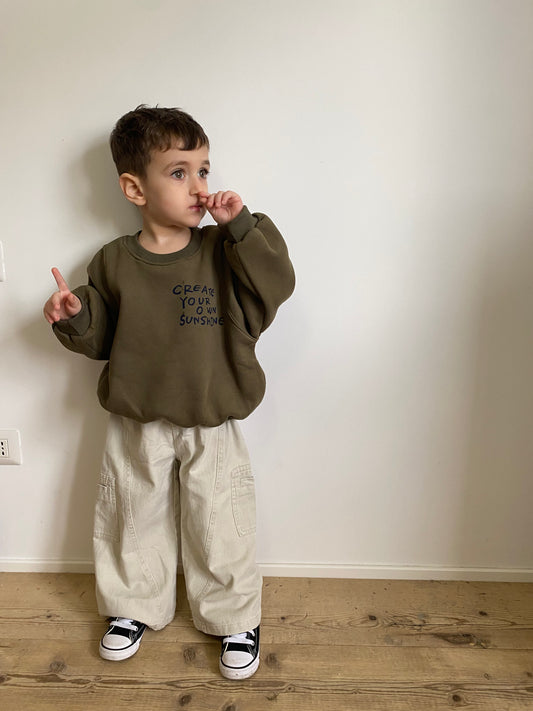 Pantalone con cucitura asimmetrica